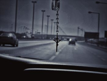 Close-up of car moving on road