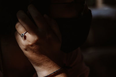 Close-up of man holding hands