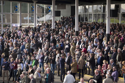 Crowd standing in front of building