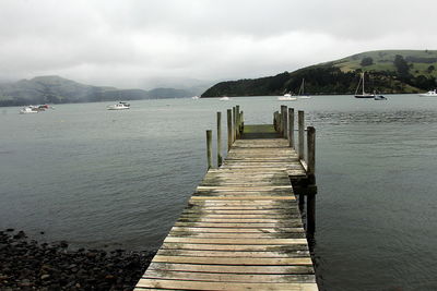 Pier over sea against sky