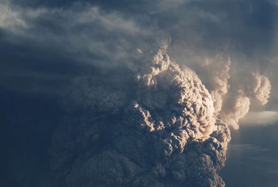 Aerial view of volcanic mountain against sky