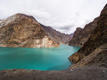 Scenic view of lake and mountains against sky