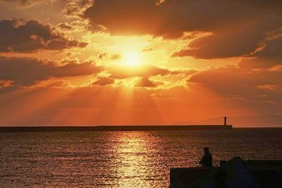 Scenic view of sea at sunset