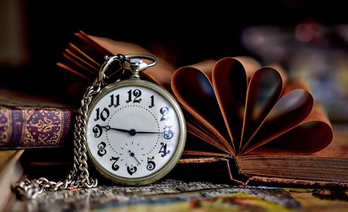 Close-up of clock on table