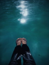 Low section of man in swimming pool