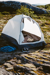 Camping tent set on a rocky terrain