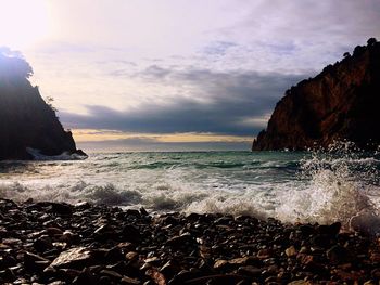 Scenic view of sea against cloudy sky