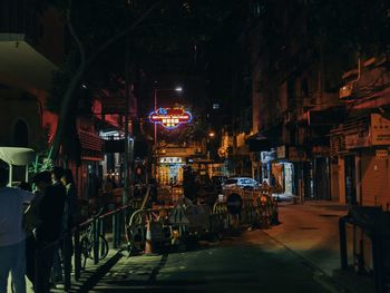 People walking on street at night