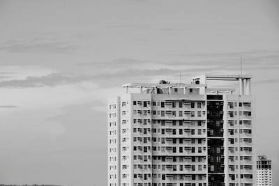 Building against cloudy sky