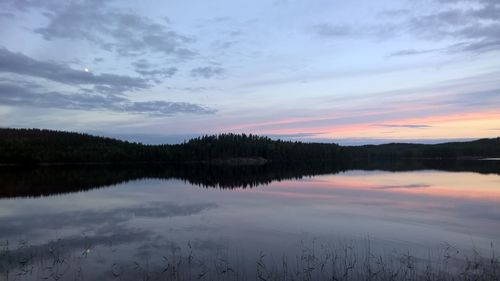 Reflection of clouds in lake during sunset