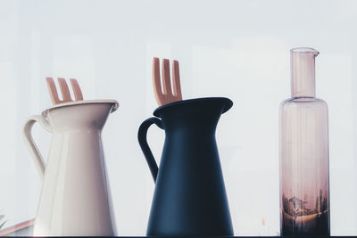 Close-up of beer glass on table against white background