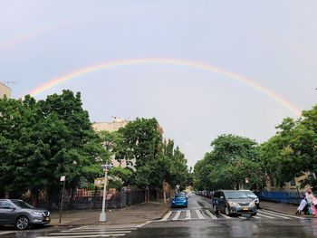 Scenic view of rainbow over street in city
