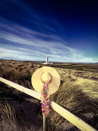 Scenic view of field against cloudy sky
