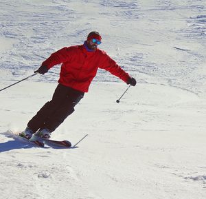 Man skiing on sunny day