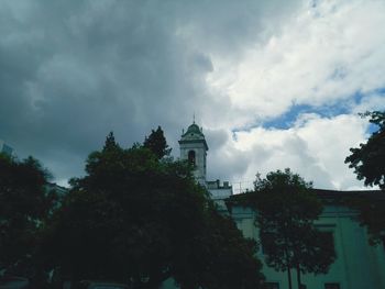 Low angle view of built structure against cloudy sky