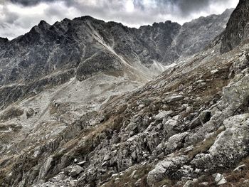 Scenic view of snow covered mountains against sky
