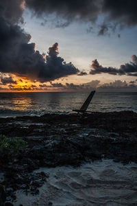 Scenic view of sea against sky at sunset