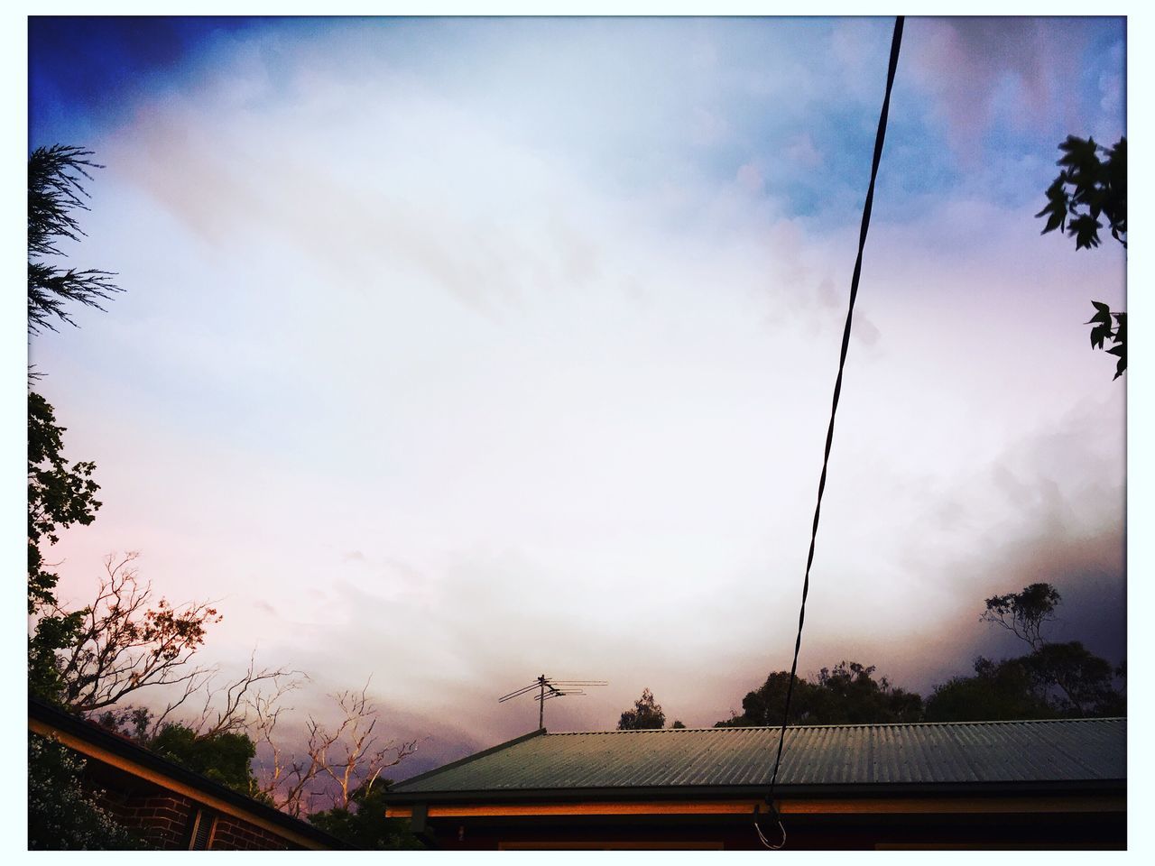 transfer print, power line, sky, auto post production filter, electricity pylon, low angle view, cloud - sky, silhouette, connection, tree, cable, power supply, electricity, sunset, cloud, cloudy, power cable, street light, dusk, transportation