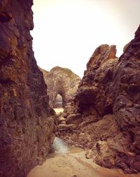 Rocks in mountains against clear sky