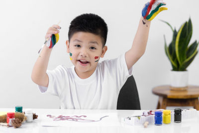 Portrait of cute boy at table