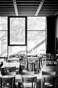 Empty chairs and tables in restaurant