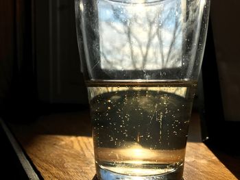 Close-up of beer glass on table