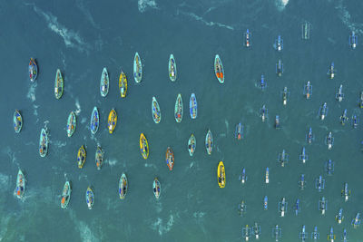 High angle view of people swimming in sea