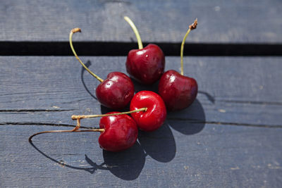 Close-up of red cherries on table