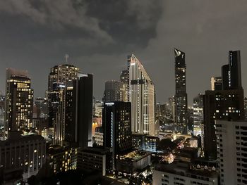 Illuminated buildings in city at night