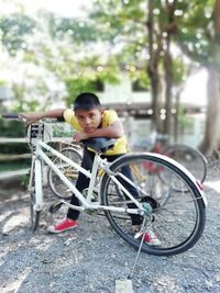 Portrait of boy riding bicycle