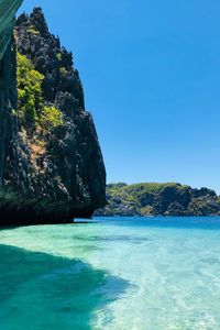 Scenic view of sea against clear blue sky