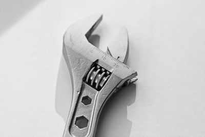 High angle view of machine on table against white background