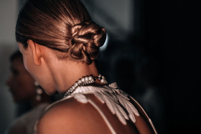 Side view of young woman looking away