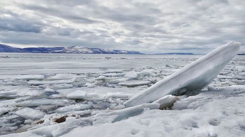 Scenic view of sea against sky during winter