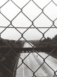 Close-up of chainlink fence against clear sky