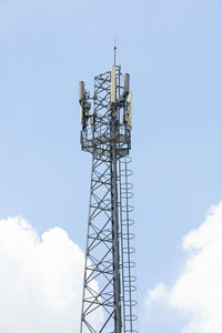 Low angle view of communications tower against sky