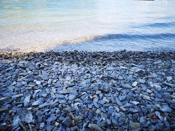 High angle view of pebbles on beach