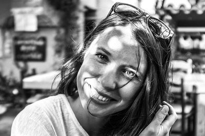 Close-up portrait of a smiling young woman