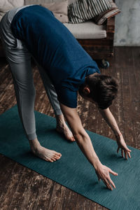 A man engaged in yoga and meditation, performing asanas