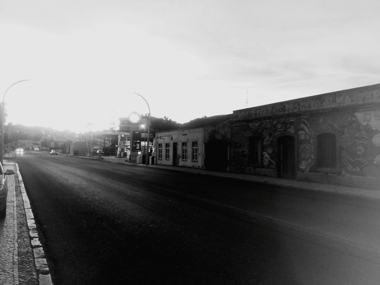 ROAD BY CITY AGAINST SKY