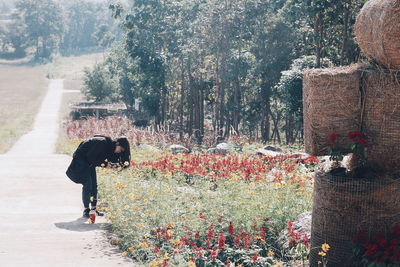 Full length of woman standing on roadside