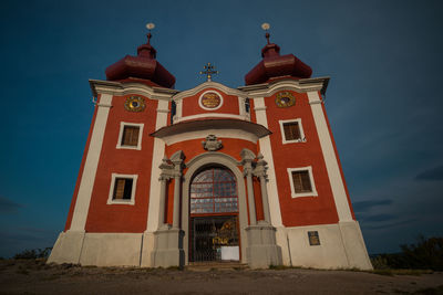 Low angle view of building against sky at dusk