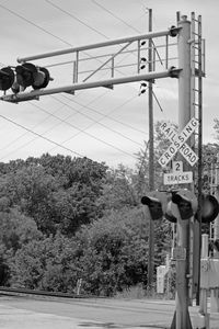 Low angle view of railroad tracks against sky