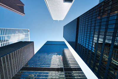 Low angle view of modern buildings against sky