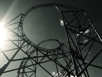 Low angle view of ferris wheel against sky