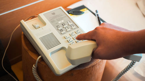 High angle view of person using smart phone on table