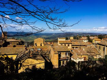 View of townscape against blue sky