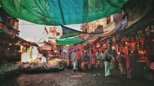 People at market stall in city