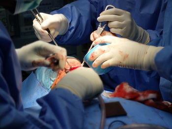 Midsection of doctor examining patient