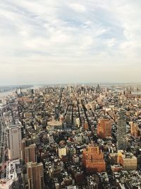 Aerial view of cityscape against sky